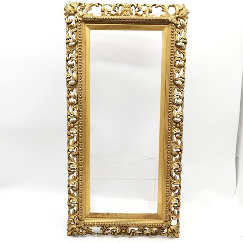 351 - Antique gilt frame with pierced repeat leaf border - 83cm x 41cm (inset 66cm x 26cm) ~ some losses