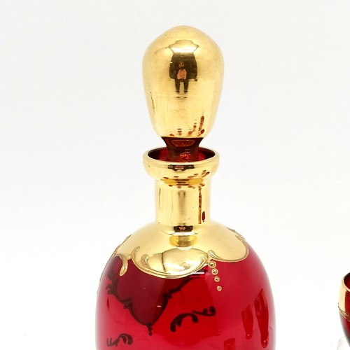 369 - Bohemian red glass liqueur decanter with 6 glasses with raised enamel & gilt detail ~ no obvious dam... 