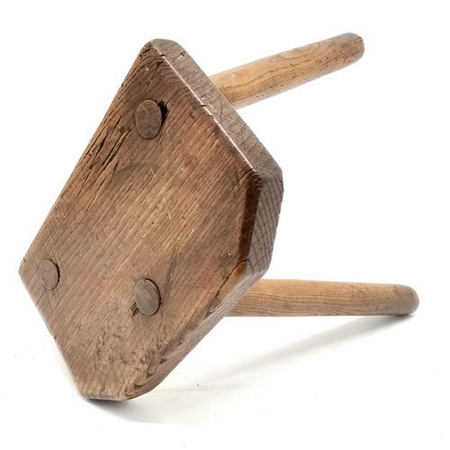 384 - Antique wooden 3 legged milking stool - 34cm high & seat is 28cm x 18.5cm ~ signs of old worm