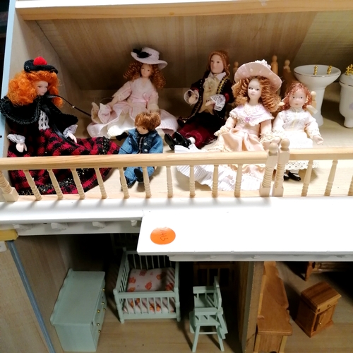 455 - Vintage 3 story dolls house with opening front and lift off roof T/W 7 dolls and a quantity of dolls... 