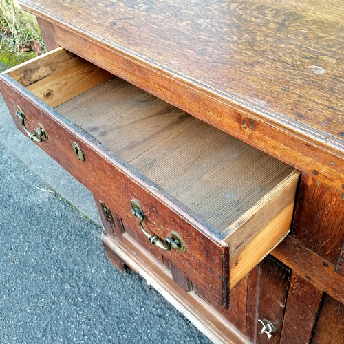 466 - Antique oak dresser base with fielded panelled detail to the doors and sides, oak drawer linings and... 