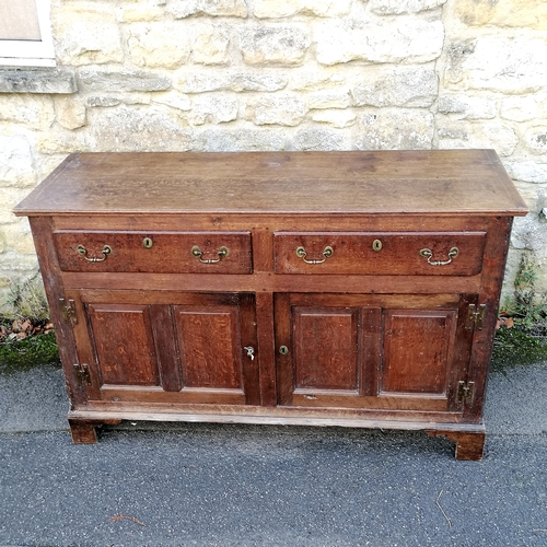 466 - Antique oak dresser base with fielded panelled detail to the doors and sides, oak drawer linings and... 