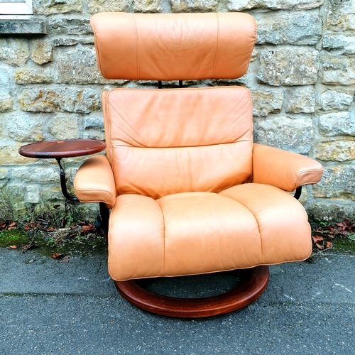 508 - Contemporary brown leather adjustable easy chair with attached side table and a matching leather sto... 