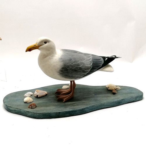 533 - Hand painted carved wooden seagull on a blue painted base with seshells 48cm long x 24cm high T/W a ... 