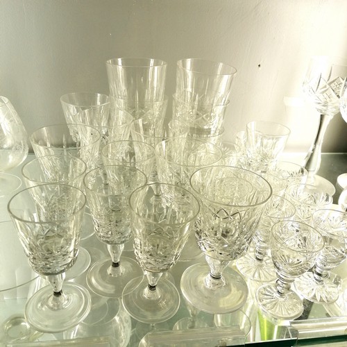 120A - Large quantity of mostly antique glassware including cake stands, 4 acid etched with courting couple... 