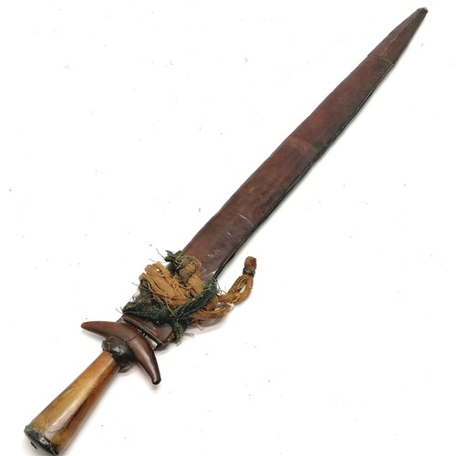 74 - Antique African Guduf sword (Mandara mountains) with horn hilt and leather over wood scabbard with c... 