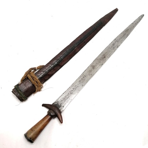 74 - Antique African Guduf sword (Mandara mountains) with horn hilt and leather over wood scabbard with c... 