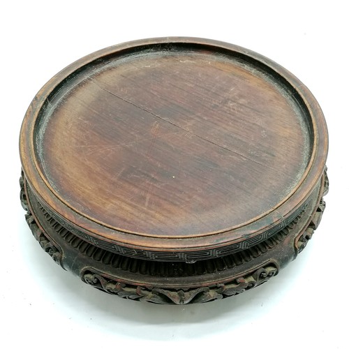 16 - Oriental antique hardwood circular stand 23cm diameter x 9cm high - has repair to one foot