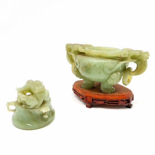 28 - Chinese carved jade / hardstone tripod censer / koro with dragon detail on a wooden base - 17.5cm ac... 