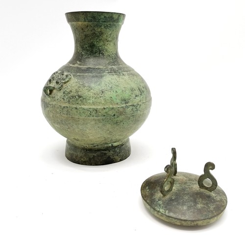 32 - Chinese bronze 'Hu' lidded ritual wine vessel with taotie detail to sides of body - 24.5cm high