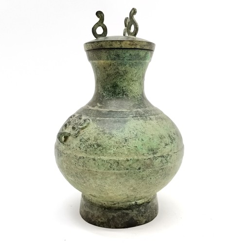 32 - Chinese bronze 'Hu' lidded ritual wine vessel with taotie detail to sides of body - 24.5cm high