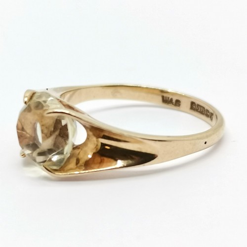 275 - 9ct gold hallmarked solitaire ring set with a yellow stone size M 2.1g total weight