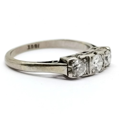 283 - Antique 18ct white gold marked 3 stone diamond ring size H½ 2.2g total weight  middle diamond 3mm di... 