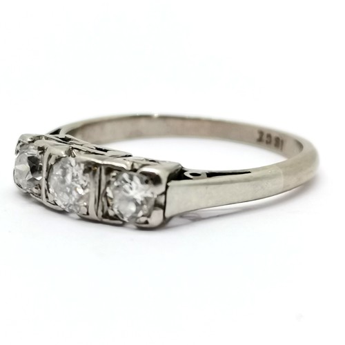 283 - Antique 18ct white gold marked 3 stone diamond ring size H½ 2.2g total weight  middle diamond 3mm di... 