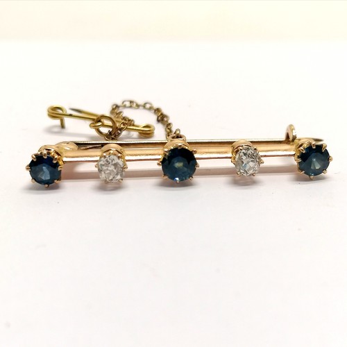 309 - Antique unmarked (touch tests as 15ct) gold diamond & sapphire bar brooch - 4cm long & 3.6g total we... 