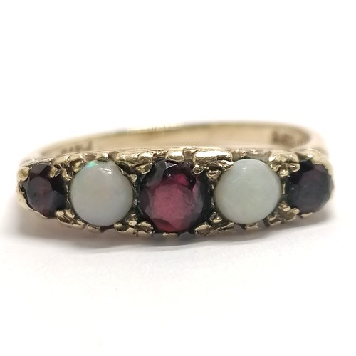 311 - 9ct hallmarked gold garnet / opal stone set ring - size M½ & 2.7g total weight