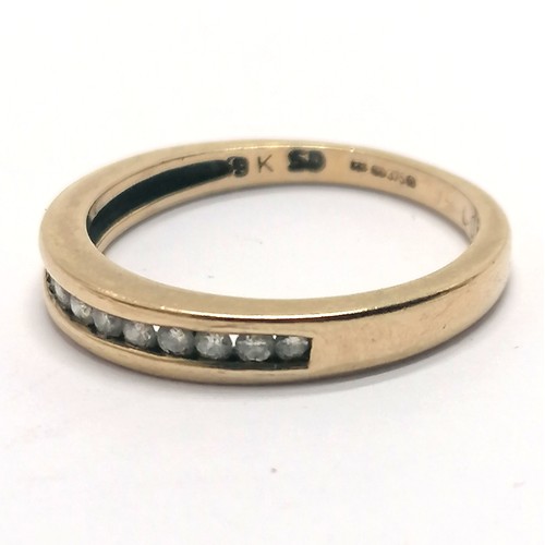 331 - 9ct hallmarked gold channel set diamond half eternity ring - size P½ & 2.7g total weight - 0.25ct di... 