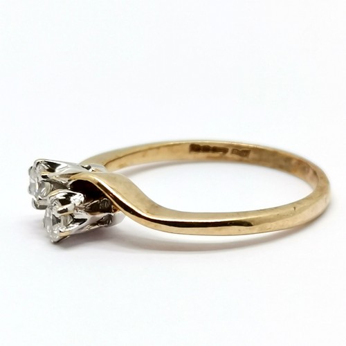 340 - 9ct hallmarked gold 2 stone diamond crossover ring - size L½ & 1.7g total weight