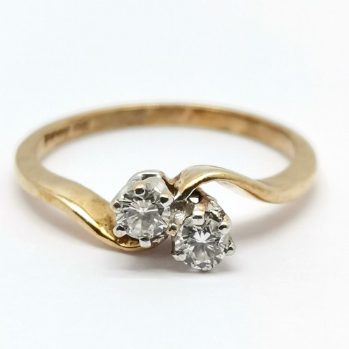 340 - 9ct hallmarked gold 2 stone diamond crossover ring - size L½ & 1.7g total weight