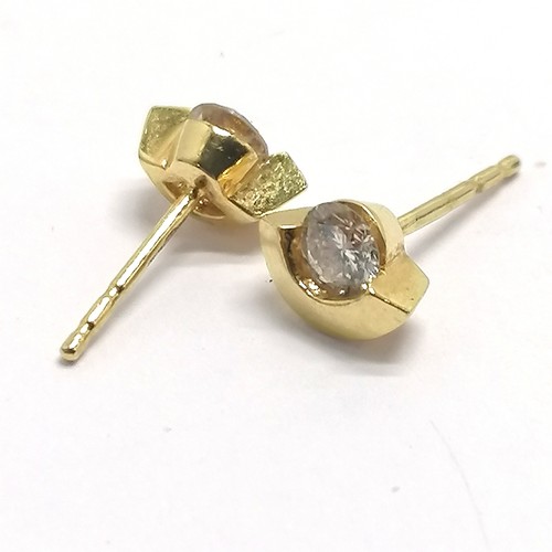 352 - 18ct hallmarked gold pair of diamond fancy stud earrings - 1g total weight