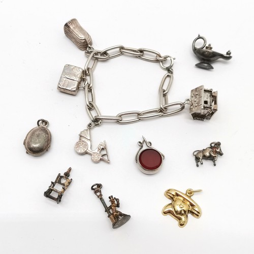 367 - Silver charm bracelet with mostly silver charms inc coracle, suitcase etc ~ total weight (lot) 39g &... 