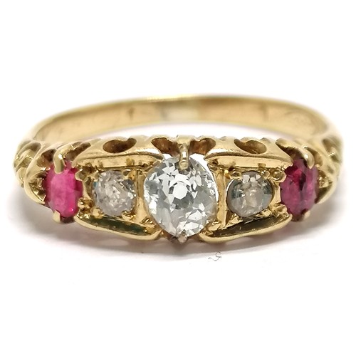 426 - Antique gold (touch tests as 18ct) ruby / diamond 5 stone ring - size N & 2.3g total weight ~ centre... 