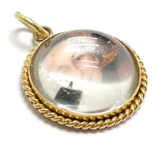 430 - Unmarked gold photographic pendant with domed rock crystal stone detail - 2cm diameter & 6.4g total ... 