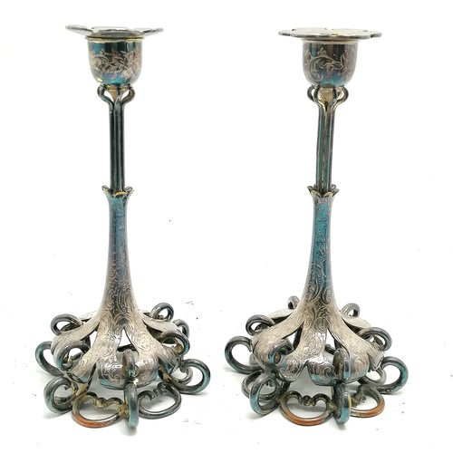 486 - Antique pair of hard metal engraved candlesticks with open work to bases - 22cm high ~ some plate lo... 