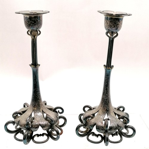 486 - Antique pair of hard metal engraved candlesticks with open work to bases - 22cm high ~ some plate lo... 