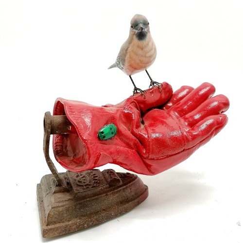 72 - Contemporary sculpture of a bird (waxwing) resting on a gardening glove eyeing up a beetle with an a... 