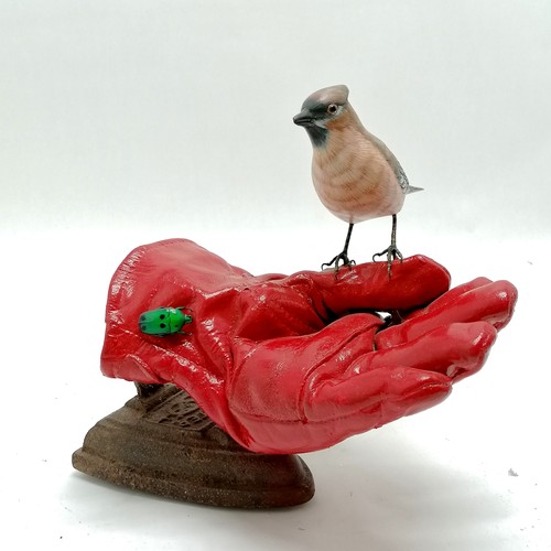 72 - Contemporary sculpture of a bird (waxwing) resting on a gardening glove eyeing up a beetle with an a... 