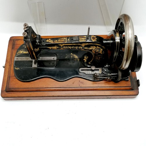 74 - Antique Singer sewing machine in original wooden case - 35cm x 25cm x 27cm high ~ mechanism moves bu... 