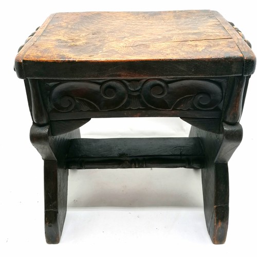 115 - Antique elm topped stool with hand carved detail - 40cm high x 41cm x 29cm