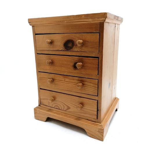 179 - Pine collectors cabinet with 4 drawers - 41.5cm high x 30cm across x 24.5cm depth