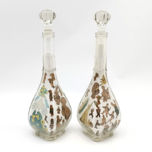 199 - Pair of glass decanters with decoupage / salt detail to the interior - 33.5cm high