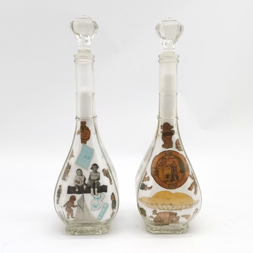 199 - Pair of glass decanters with decoupage / salt detail to the interior - 33.5cm high