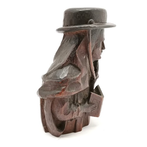 220 - Antique wood carving of figure wearing hat & with prayer book - 18cm high