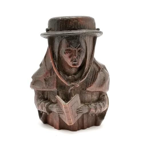 220 - Antique wood carving of figure wearing hat & with prayer book - 18cm high