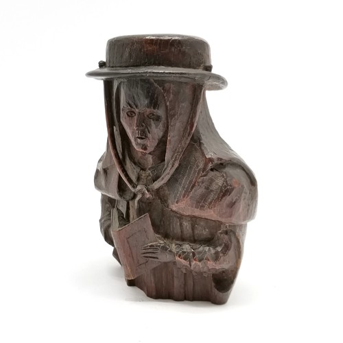 220 - Antique wood carving of figure wearing hat & with prayer book - 18cm high