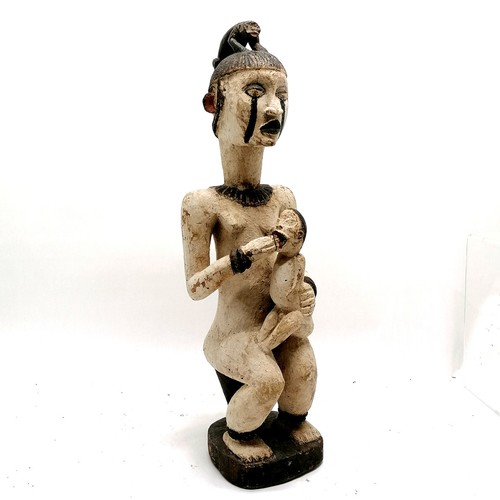 224 - Tribal hand carved wooden figure of a female figure with animal figure on head feeding a baby - 62cm... 