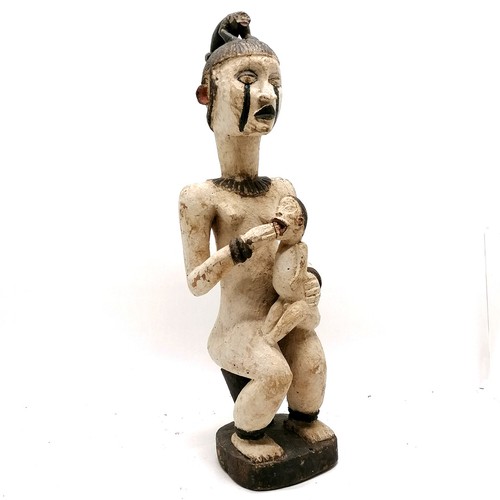 224 - Tribal hand carved wooden figure of a female figure with animal figure on head feeding a baby - 62cm... 