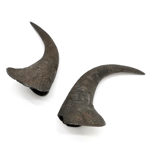 245 - Pair of tribal horns with prolific carved detail - longest 35cm and both are a/f