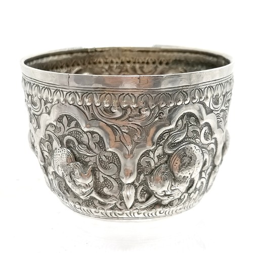 24 - Antique Shan Burmese silver bowl decorated with embossed mythical animal decoration 65g 7.5cm diamet... 