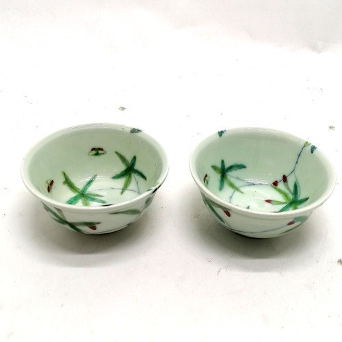 50 - Pair of Chinese ceramic bowls decorated with butterflies and leaf detail with character marks to bas... 