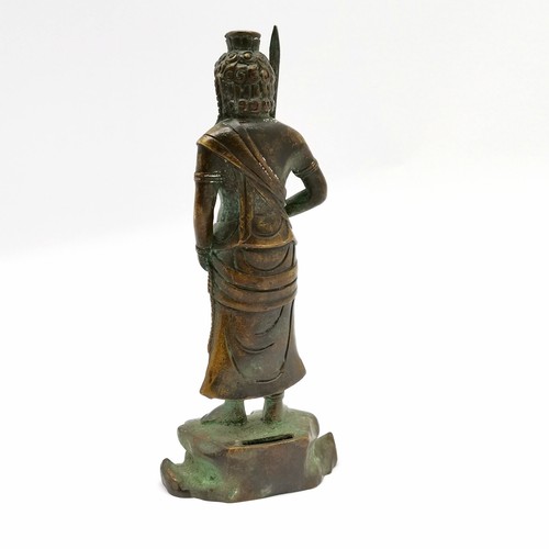 63 - Asian bronze cast deity with sword - 22cm high