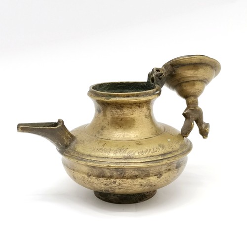 64 - Asian metal ghee oil vessel with peacock bird detail to hinged lid - 15cm high