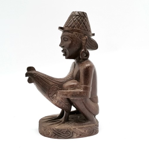 66 - Asian hand carved wooden figure of crouching man holding large cockerel- 23cm high