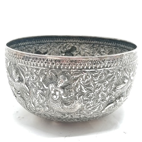 101 - Asian antique silver marked singing bowl with embossed figural detail & on 4 bun feet and marks to t... 