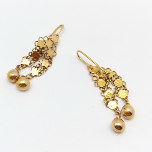 549 - 14ct marked gold pair of stars + ball drop earrings - 4cm drop & 4.5g