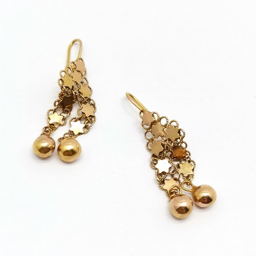 549 - 14ct marked gold pair of stars + ball drop earrings - 4cm drop & 4.5g